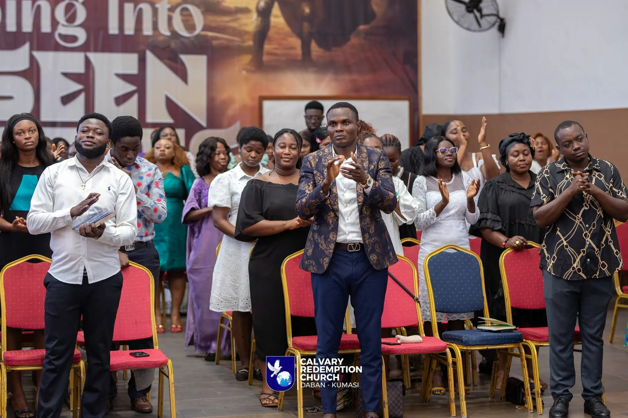 The congregation standing in worship