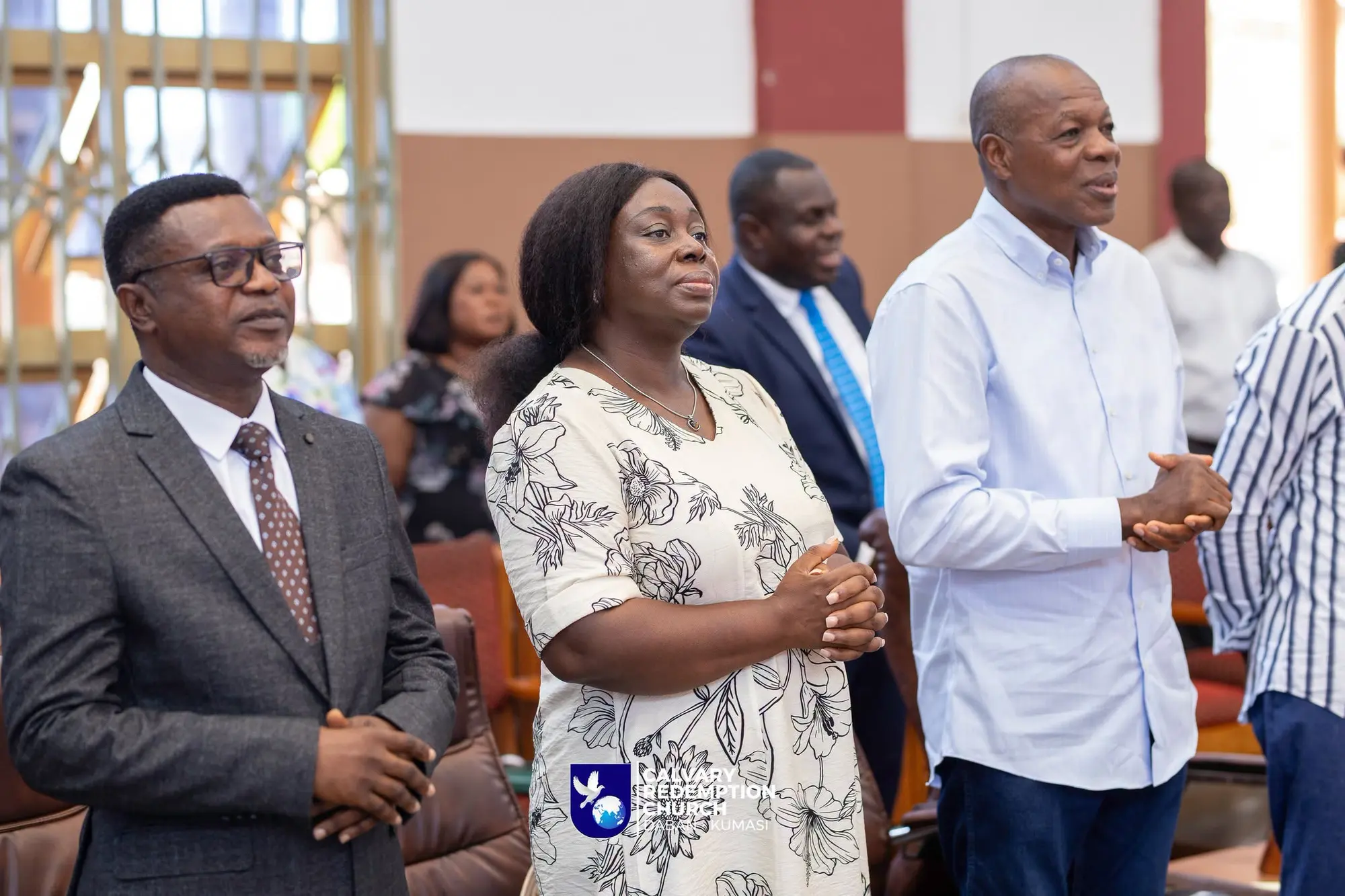 Church leaders standing in prayer
