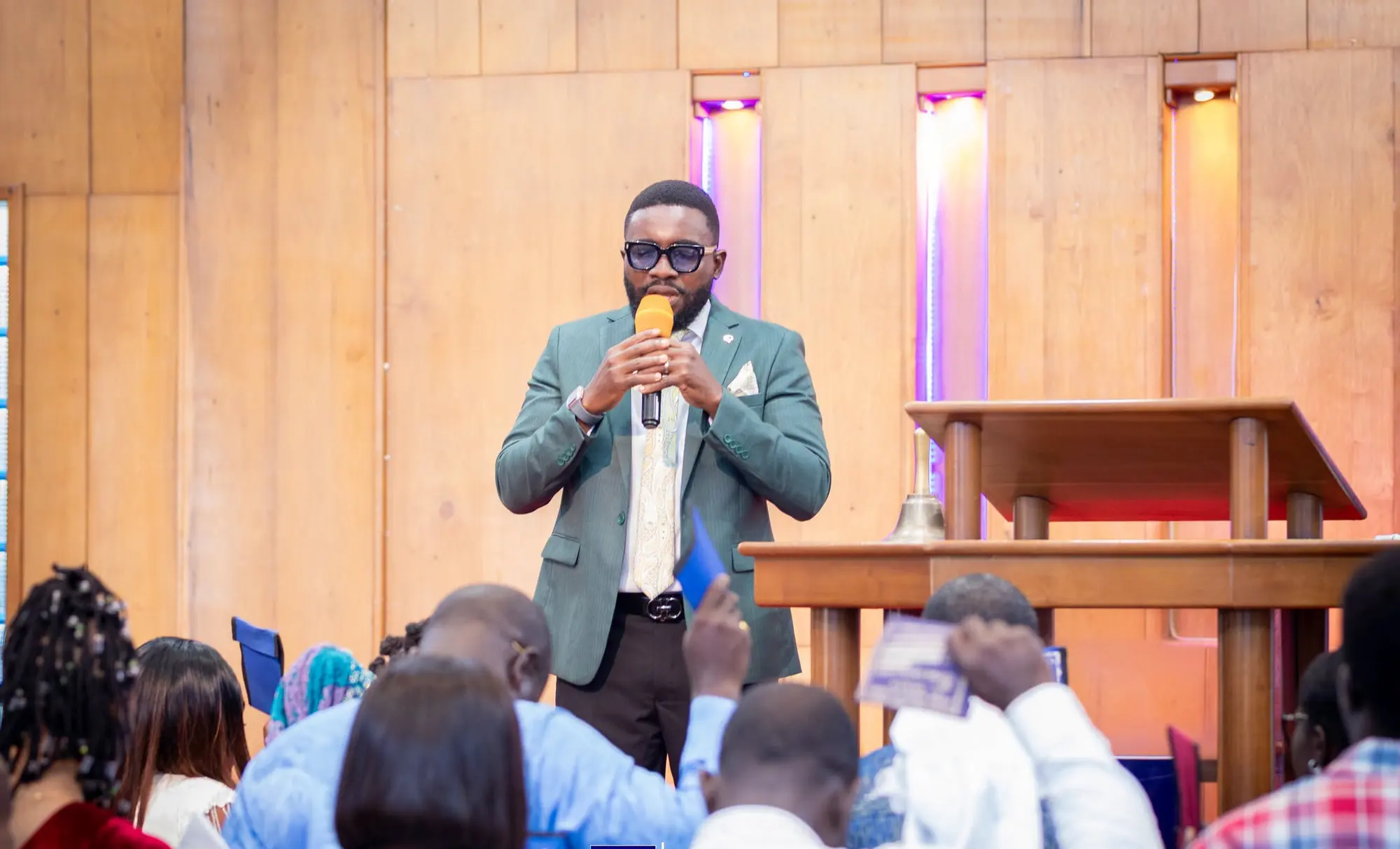 A minister preaching from the platform